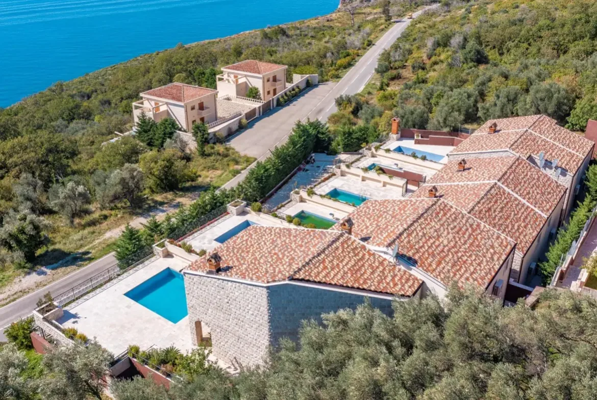 A complex of stone villas with swimming pools and a panoramic view of the sea, Budva, Reževići