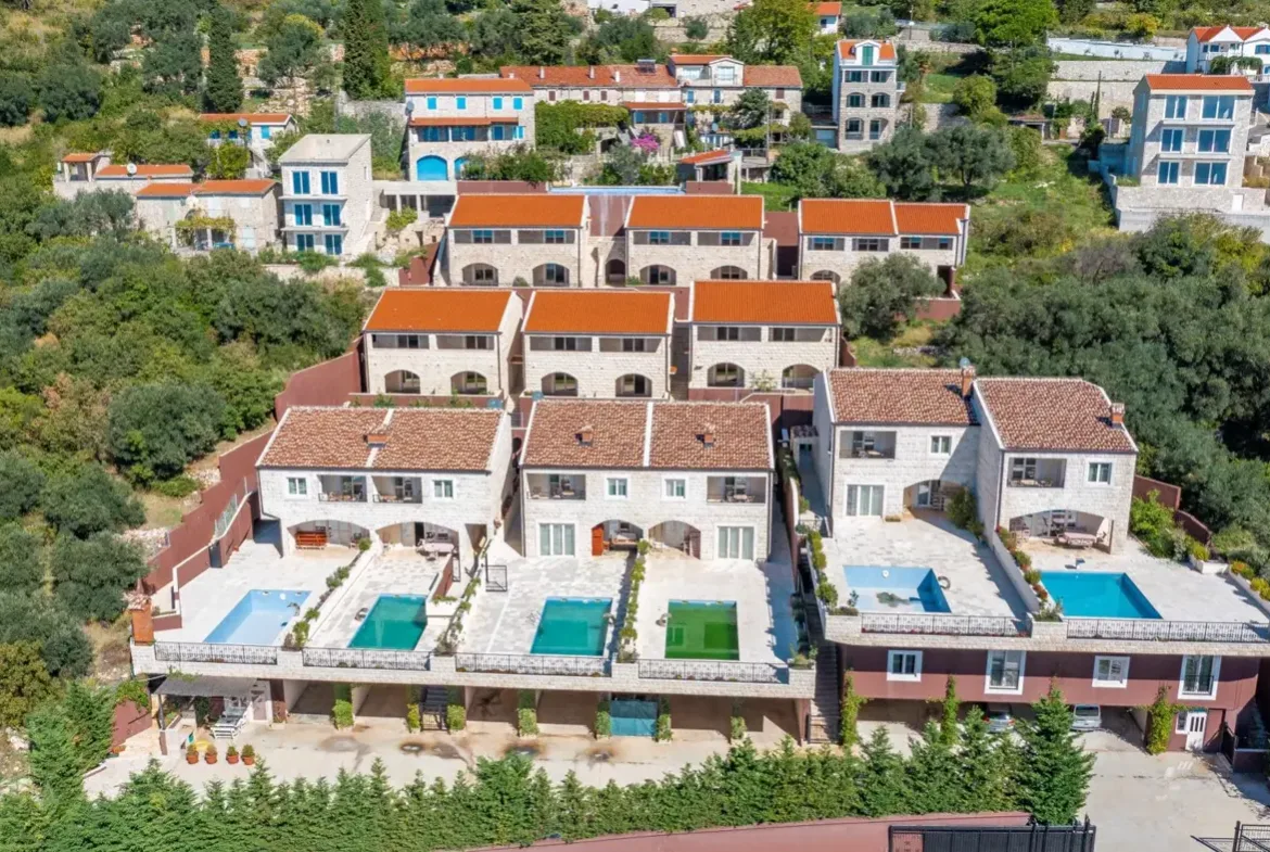 A complex of stone villas with swimming pools and a panoramic view of the sea, Budva, Reževići