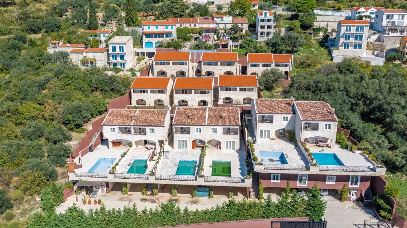 A complex of stone villas with swimming pools and a panoramic view of the sea, Budva, Reževići