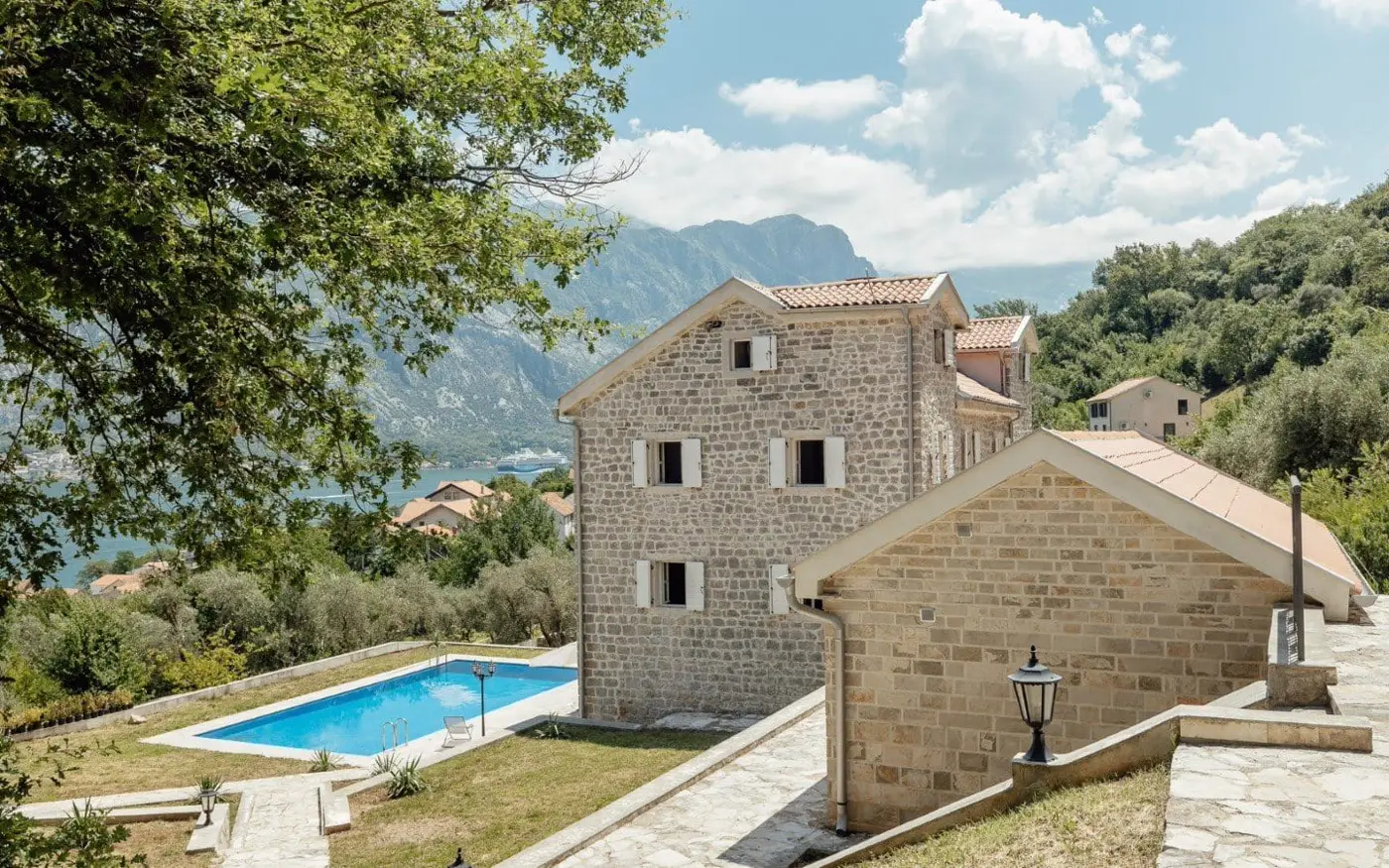 Palazzo Jerovica, a complex of stone villas and houses with a pool and a view of the bay, Kotor