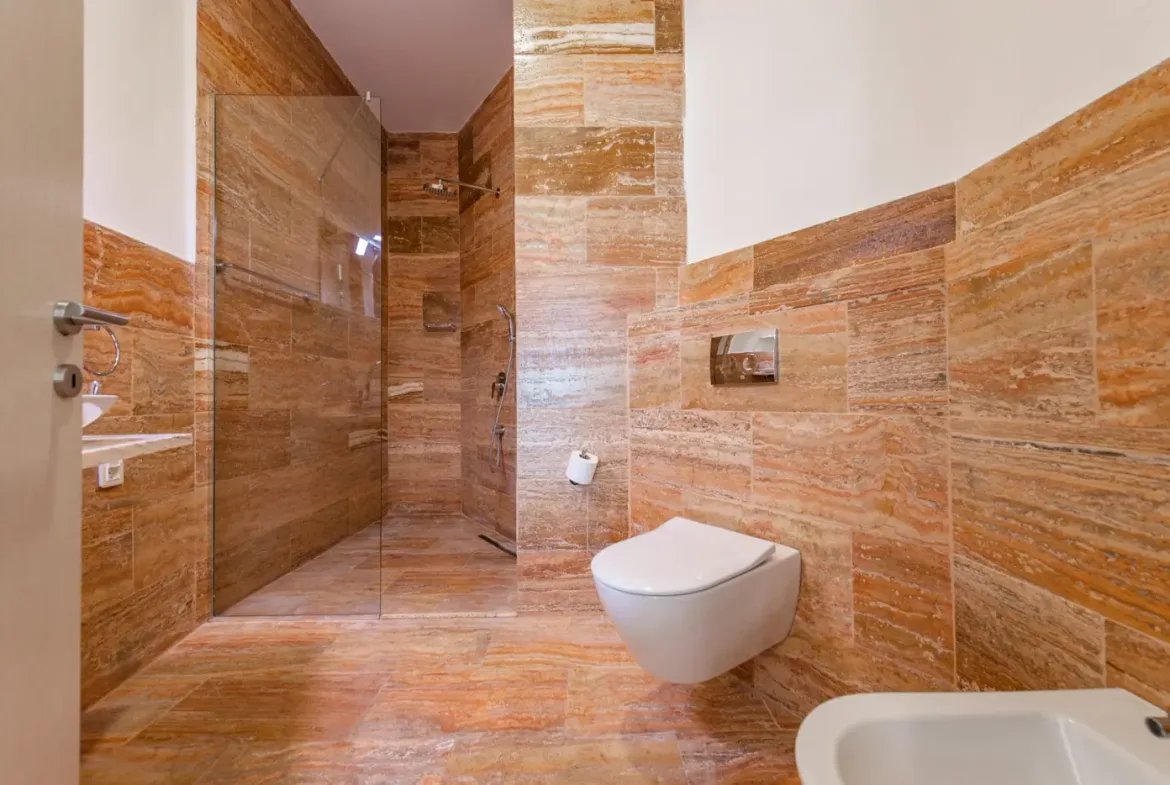 A complex of stone villas with swimming pools and a panoramic view of the sea, Budva, Reževići