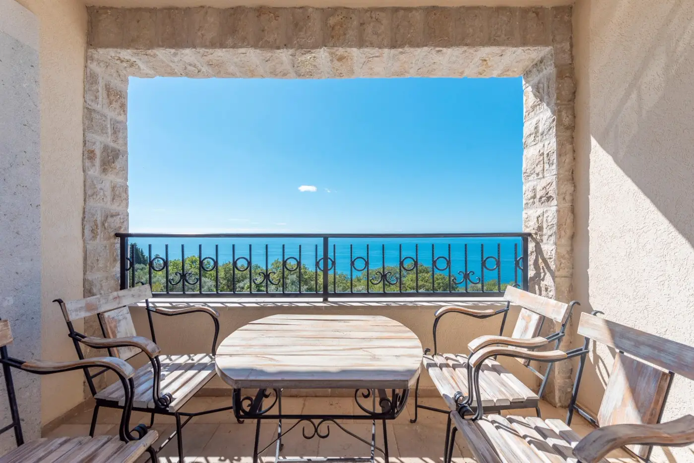 A complex of stone villas with swimming pools and a panoramic view of the sea, Budva, Reževići