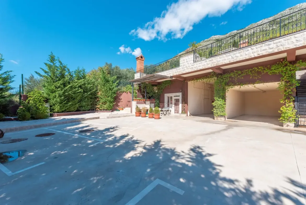 A complex of stone villas with swimming pools and a panoramic view of the sea, Budva, Reževići
