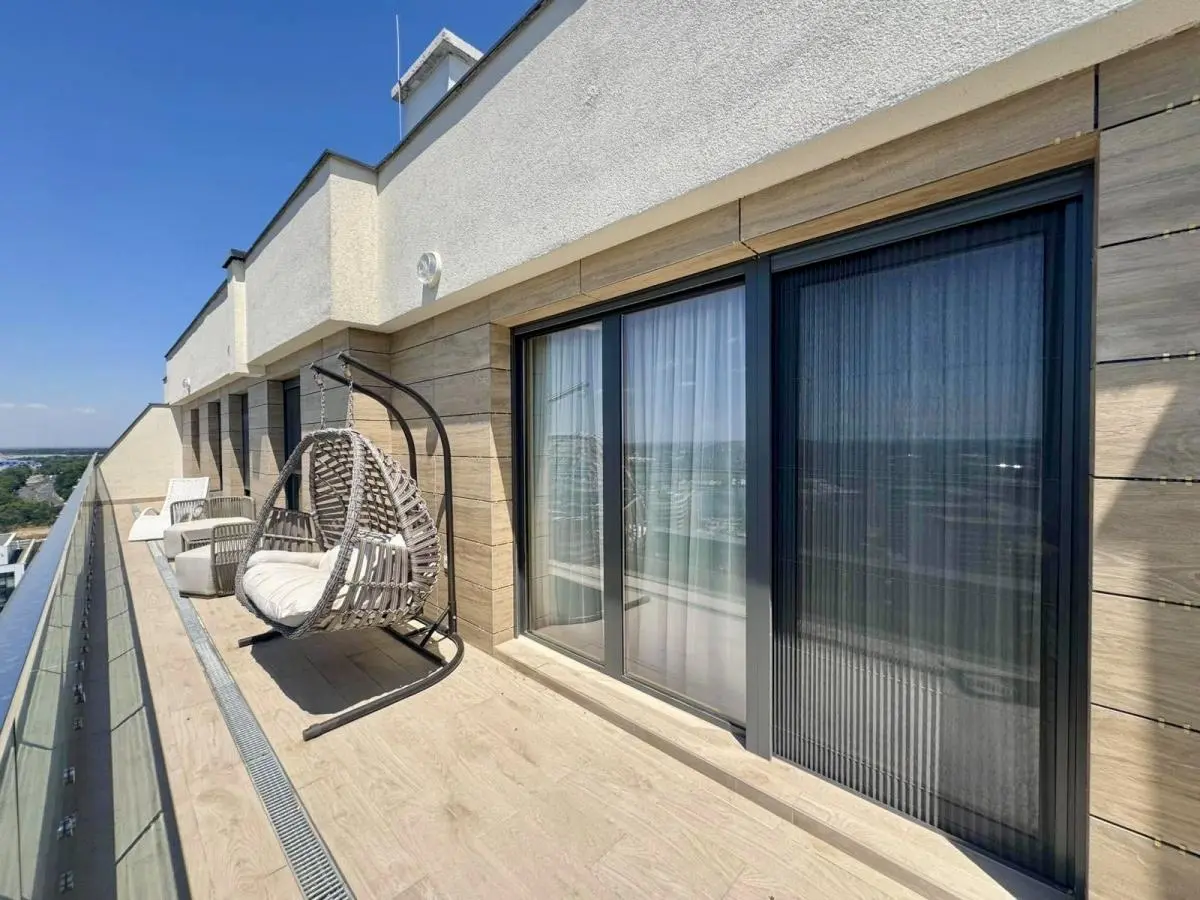 Elegant Four-Bedroom Apartment with Panoramic Views in the Wellport Residential Complex