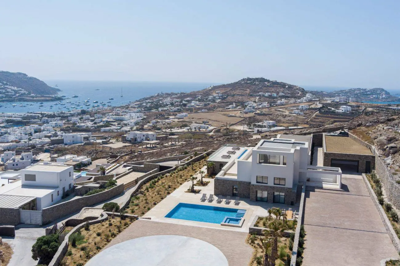 Contemporary ultra-luxury estate in Mykonos with helipad, dual pools & panoramic Aegean views