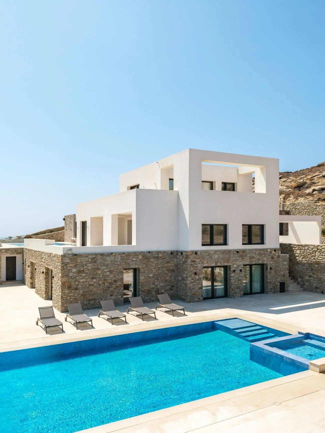 Contemporary ultra-luxury estate in Mykonos with helipad, dual pools & panoramic Aegean views