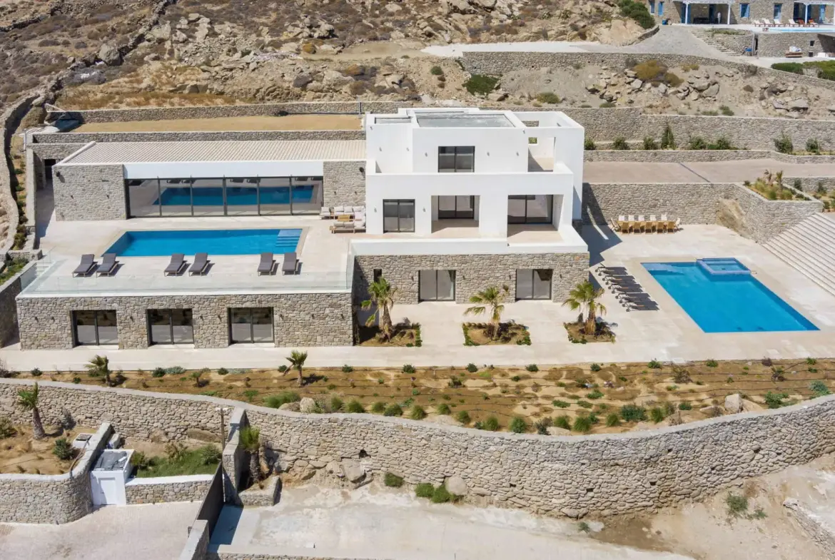Contemporary ultra-luxury estate in Mykonos with helipad, dual pools & panoramic Aegean views