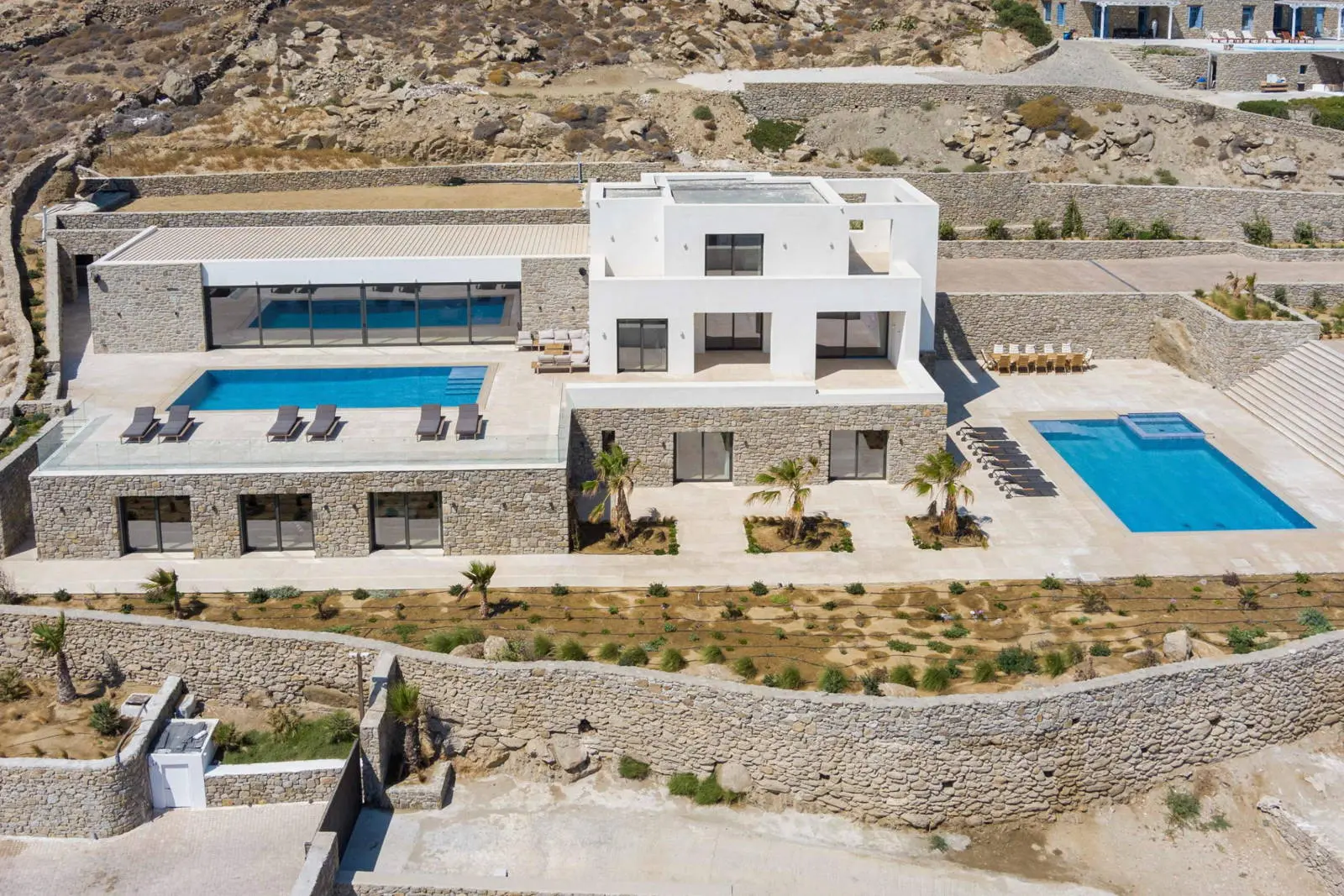 Contemporary ultra-luxury estate in Mykonos with helipad, dual pools & panoramic Aegean views