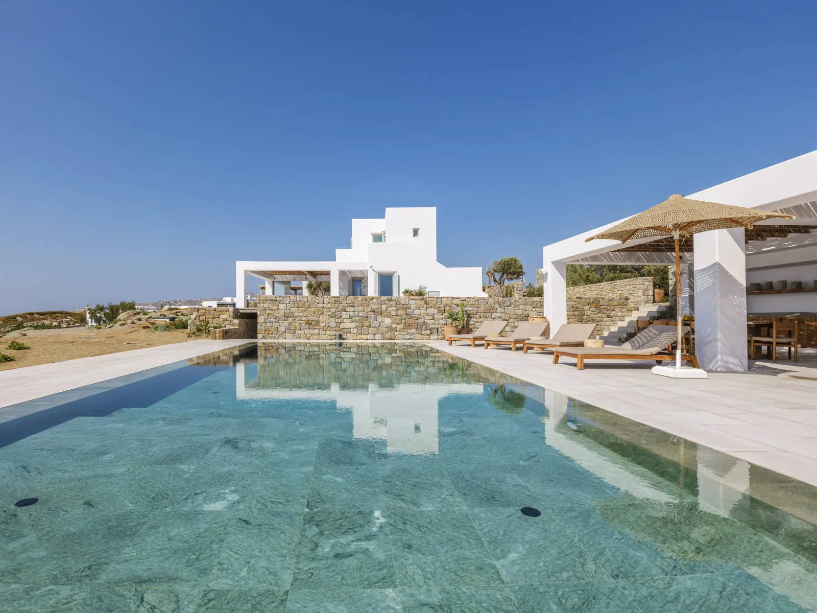 bh-e3c3a61eed52 Seafront villa with private beach access and sunset views in Mykonos