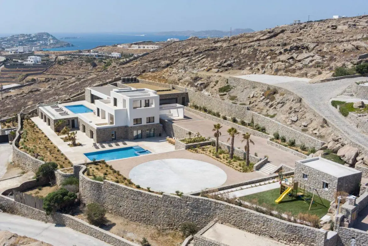 Contemporary ultra-luxury estate in Mykonos with helipad, dual pools & panoramic Aegean views