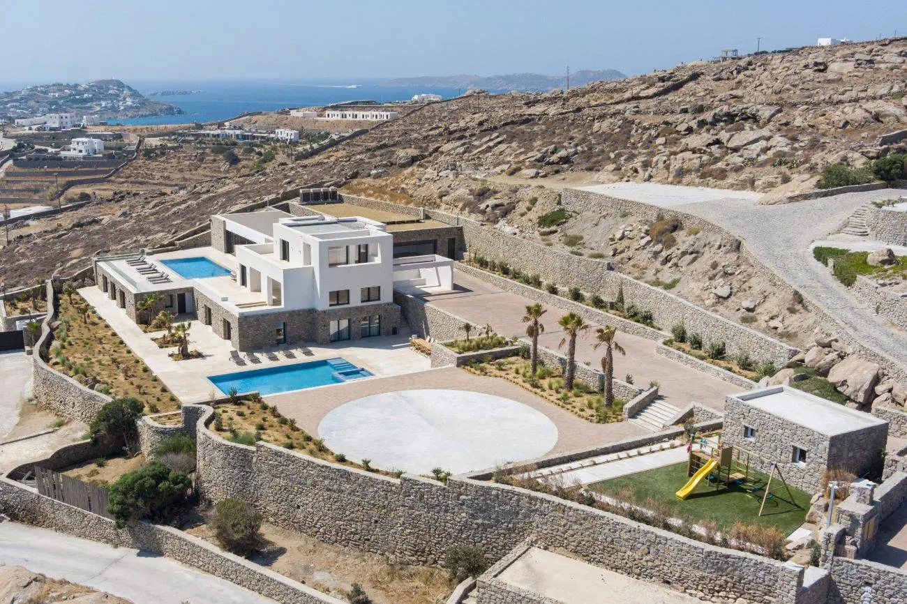 Contemporary ultra-luxury estate in Mykonos with helipad, dual pools & panoramic Aegean views