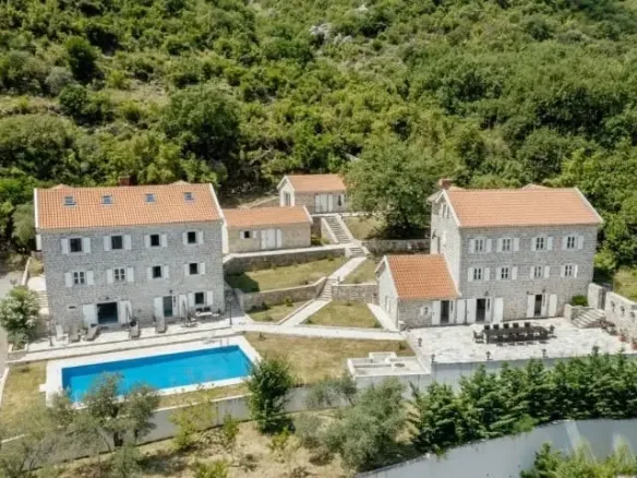 Palazzo Jerovica, a complex of stone villas and houses with a pool and a view of the bay, Kotor