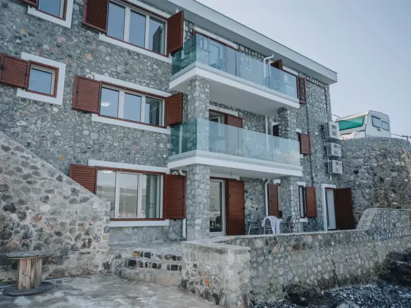 For sale seafront stone house with three apartments in Krasici