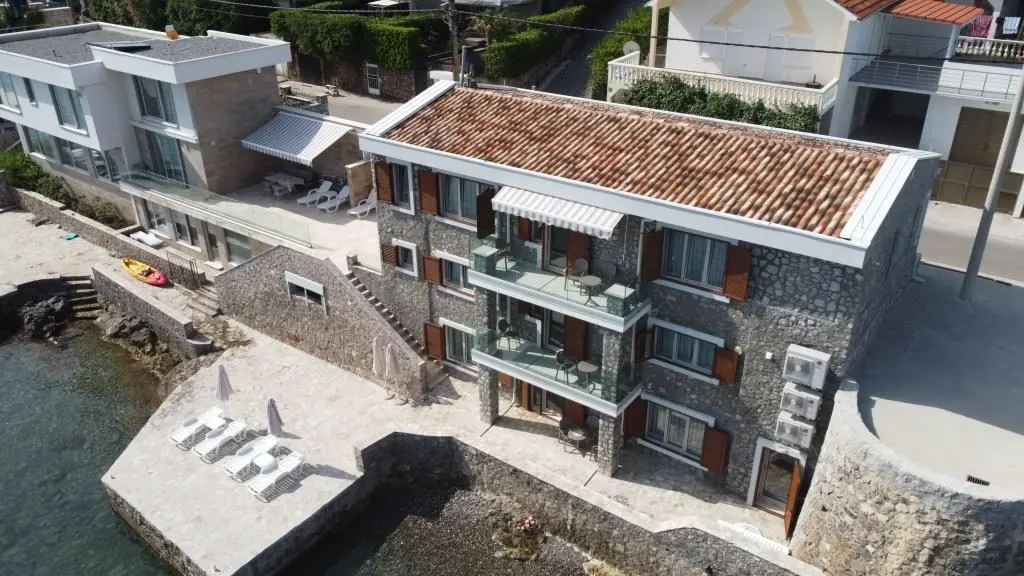 For sale seafront stone house with three apartments in Krasici