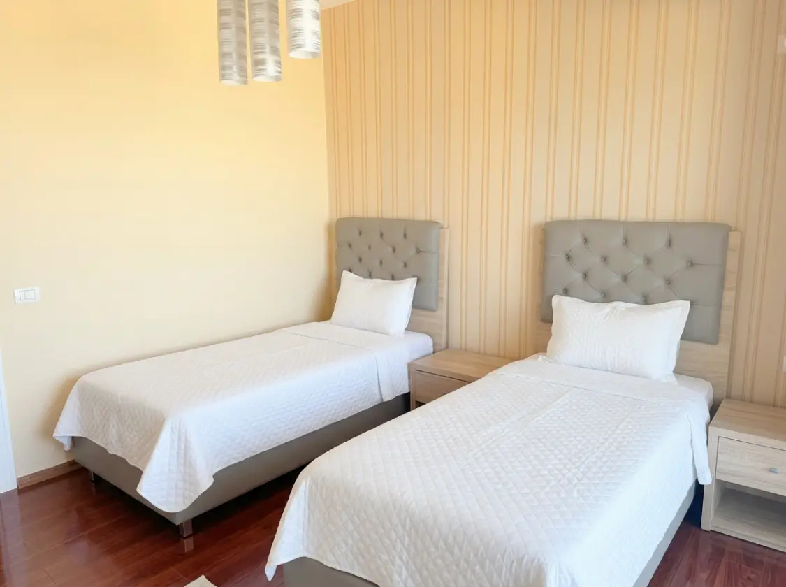 firefly-gemini-flash-enhance-brightness-make-the-beds-with-w-1 Beachfront Two-Bedroom Apartment for Sale in Durrës