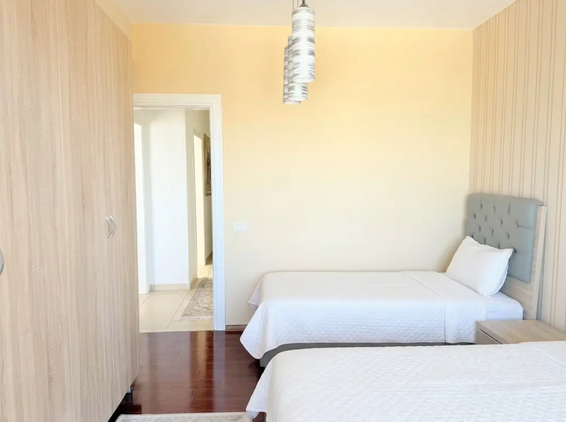 firefly-gemini-flash-enhance-brightness-make-the-beds-with-w-2 Beachfront Two-Bedroom Apartment for Sale in Durrës