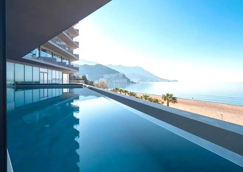 Luxury apartments in a condo hotel on the seafront, Becici