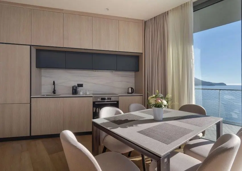 Luxury apartments in a condo hotel on the seafront, Becici