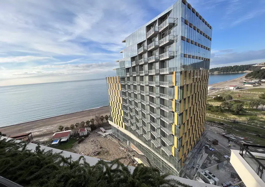 Luxury apartments in a condo hotel on the seafront, Becici