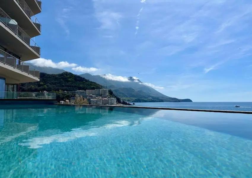 Luxury apartments in a condo hotel on the seafront, Becici