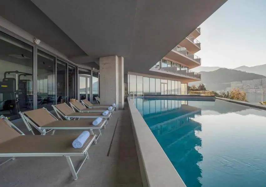 Luxury apartments in a condo hotel on the seafront, Becici
