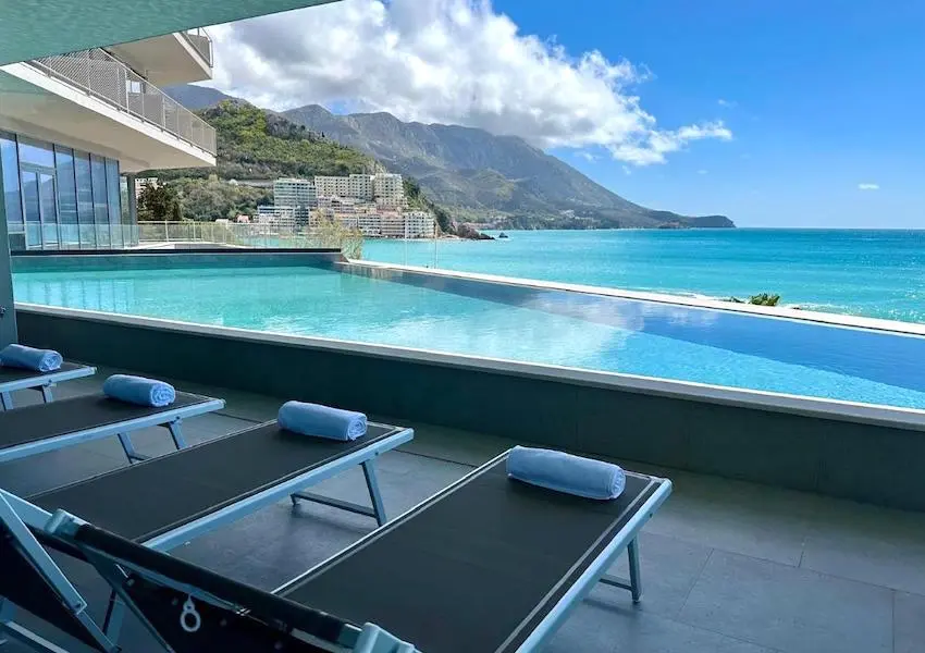 Luxury apartments in a condo hotel on the seafront, Becici