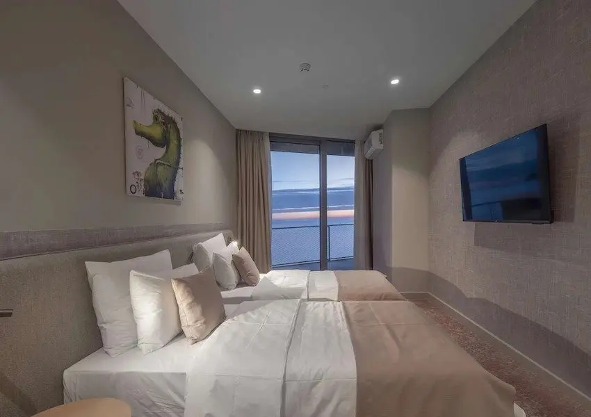 Luxury apartments in a condo hotel on the seafront, Becici